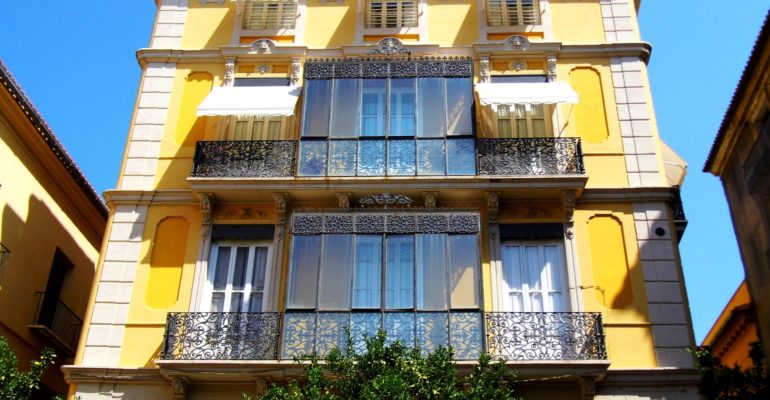 Yellow building, balconies, Valencia real estate.