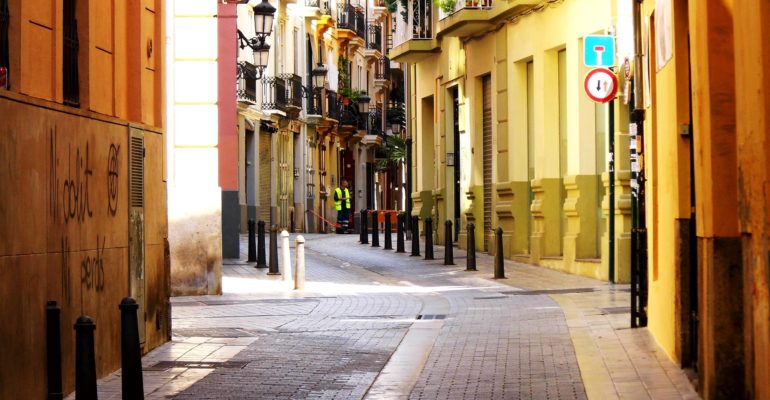 Valencia's bustling urban scene showcases diverse real estate options along its vibrant streets.