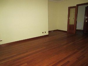 A LAREDO apartment furnished with wooden floors and a door, in the vibrant city of San Sebastian.