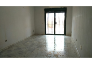 An empty apartment with a sliding glass door in Malaga-FUENGIROLA.