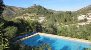 7 Bedrooms Villa With 6 En-Suite Bathrooms surrounded by mountains and trees in Lliber – Jalon Valley with a swimming pool.