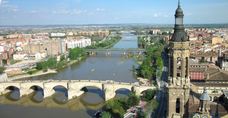 A bridge connecting Zaragoza's real estate market over a river.
