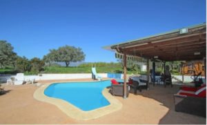 A Detached Villa with a swimming pool and patio for sale in Coín.