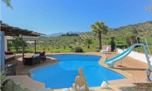Detached Villa for sale with swimming pool and slide in Coín.