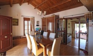 Detached villa for sale in Coín with wooden ceilings and floors.