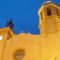 A Sitges real estate property featuring a charming brick building with a clock tower.