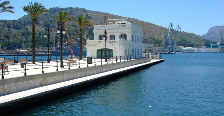 A waterfront white building in Murcia real estate.