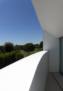 Your dream house in Spain with a white balcony overlooking the golf course.