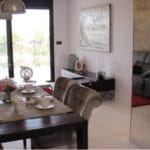 A Mil Palmeras living room with a dining table and chairs in Costa Blanca South.