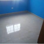 A terraced house in Tenerife with blue walls and tile floors.