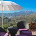 A detached villa for sale in Tolox with a patio offering mountain views.
