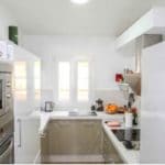 Detached 4 bedrooms Villa with a white kitchen and stove/oven for sale in Tolox.