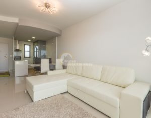 A luxury apartment in La Zenia on the Costa Blanca South, featuring a white couch and coffee table.