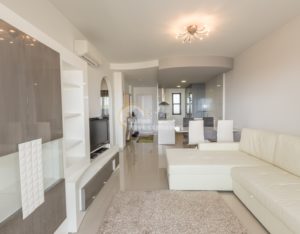 A luxurious apartment in Costa Blanca South, La Zenia with a white couch and TV.