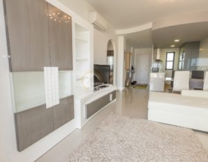 A luxury apartment in La Zenia, Costa Blanca South, featuring a white couch and TV.
