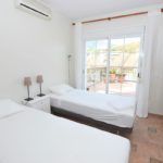 Detached Villas in Mijas Costa with two beds and a sliding glass door in each room.