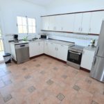 A Detached Villa in Mijas Costa with stainless steel appliances and tile floors.