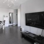 A beautiful 3 bedroom apartment in Los Cristianos with a living room featuring a TV and dining table.