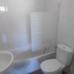 Beautiful 3 bedroom apartment in Los Cristianos with a small bathroom equipped with a toilet, sink and shower.