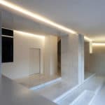 An architect's renovation works transformed a modern house in Spain, with white walls and marble floors.