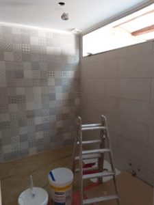 Renovation project: Costa Blanca property for sale with tiled walls and a ladder.
