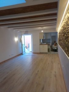 Property for sale in Costa Blanca South with a stone wall and wooden floors.