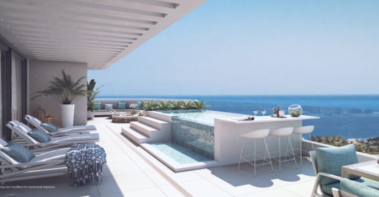 A rendering of a balcony with lounge chairs and a view of the ocean.