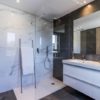 New build penthouse with modern bathroom and marble floors.