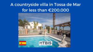 Photo of a charming countryside villa in Tossa de Mar with a pool, surrounded by a patio. An advertisement banner indicates this property for sale in Costa Brava is available for less than €200,000 and shows the Spanish flag.
