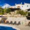 A holiday villa with a swimming pool and sun loungers for sale in Calonge, Costa Brava.