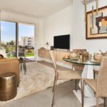 New build apartment in Cala d'or with a living room featuring a dining table and chairs.