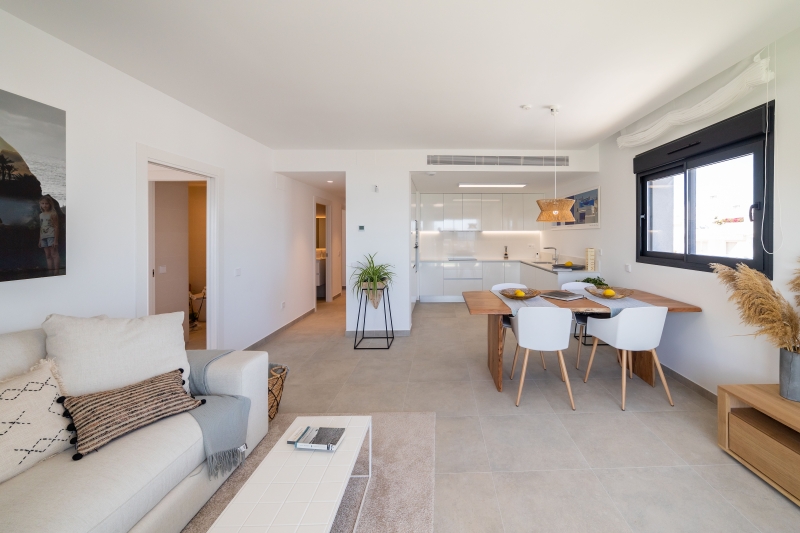 A modern living and dining room in an Alicante New Build Apartment.