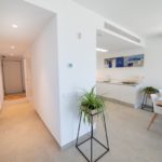 A modern apartment with a kitchen and dining area in Alicante, available for sale.