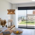 Gran Alicante New Build Apartment with a balcony overlooking the sea.