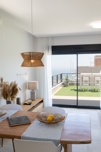 Gran Alicante New Build Apartment with a balcony overlooking the sea.