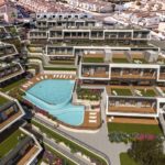An aerial view of a new build apartment with a pool in Alicante.