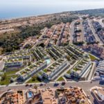 Alicante property for sale: Aerial view of an apartment complex near the beach.