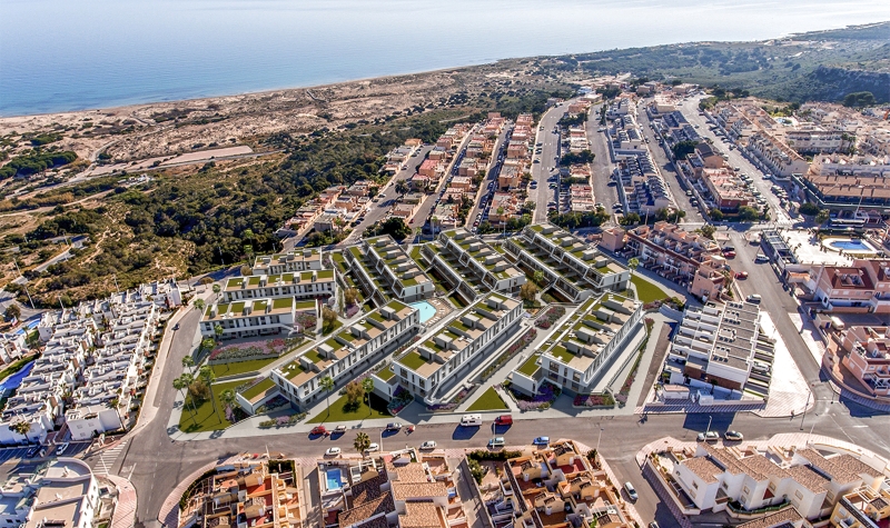 Alicante property for sale: Aerial view of an apartment complex near the beach.