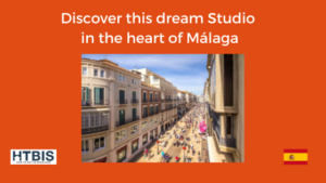 Advertisement for a studio in Málaga. The image shows a busy street with historic buildings and numerous pedestrians. The text promotes a studio located in the heart of Málaga, perfect for anyone interested in Malaga real estate investment. Logos and a Spanish flag are shown.