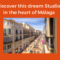 Advertisement for a studio in Málaga. The image shows a busy street with historic buildings and numerous pedestrians. The text promotes a studio located in the heart of Málaga, perfect for anyone interested in Malaga real estate investment. Logos and a Spanish flag are shown.
