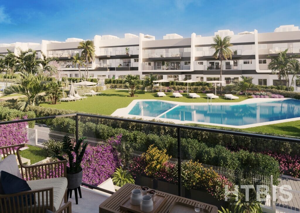 A view of a new build apartment complex in Gran Alicante, featuring a swimming pool.