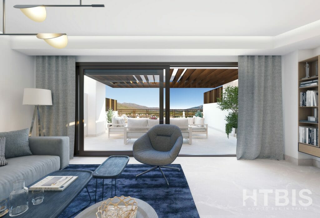 A living room in a new build townhouse Mijas with a sliding glass door and a view of the mountains.