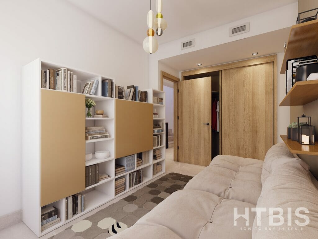 A living room with bookshelves and a couch in a new build townhouse Mijas.