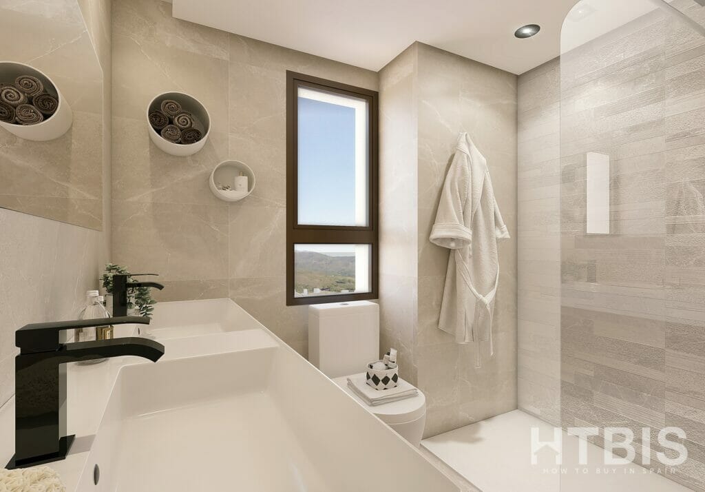 A modern bathroom in a new build townhouse in Mijas, featuring a glass shower and sink.