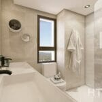 A modern bathroom in a new build townhouse in Mijas, featuring a glass shower and sink.