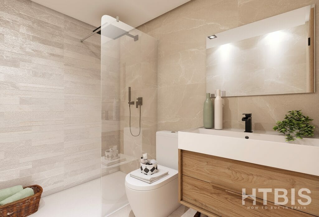 A bathroom with a toilet, sink, and shower in a new build townhouse Mijas.