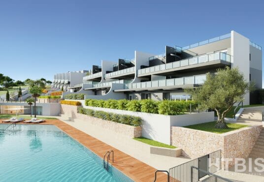 A modern apartment complex with a swimming pool, offering cheap Alicante property for sale.