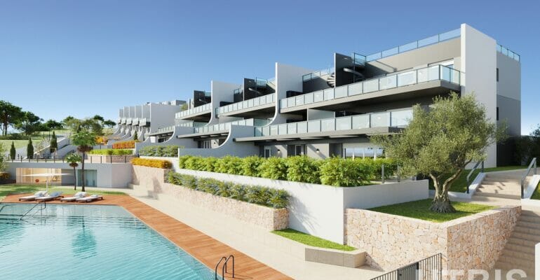 A modern apartment complex with a swimming pool, offering cheap Alicante property for sale.