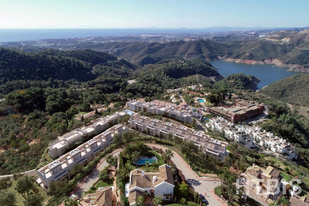 An aerial view of an apartment complex in the mountains in Malaga.