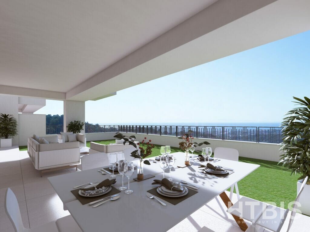 An apartment in Malaga with a balcony overlooking the ocean.